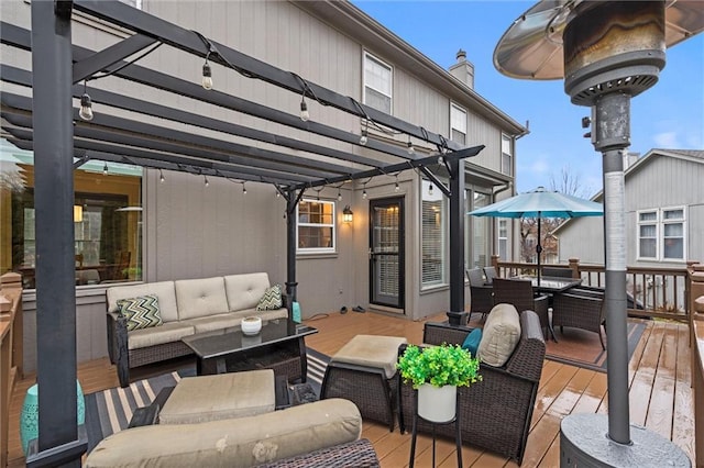 wooden terrace featuring an outdoor living space and outdoor dining area