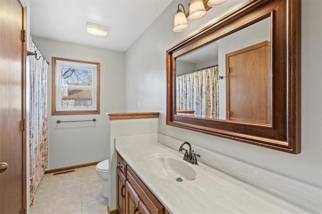 full bathroom featuring vanity, baseboards, visible vents, tile patterned flooring, and toilet