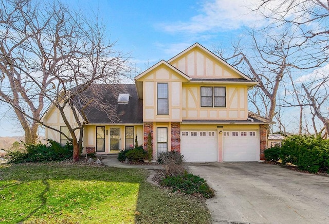 tudor home with brick siding, stucco siding, concrete driveway, and a garage