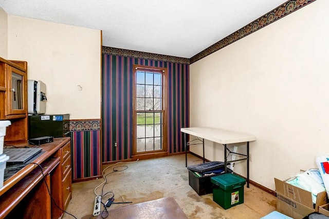 kitchen with glass insert cabinets, wallpapered walls, carpet, and baseboards