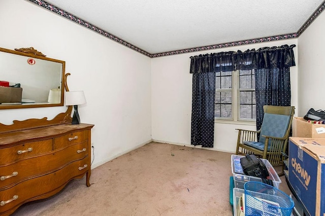 living area featuring light carpet, a textured ceiling, and baseboards