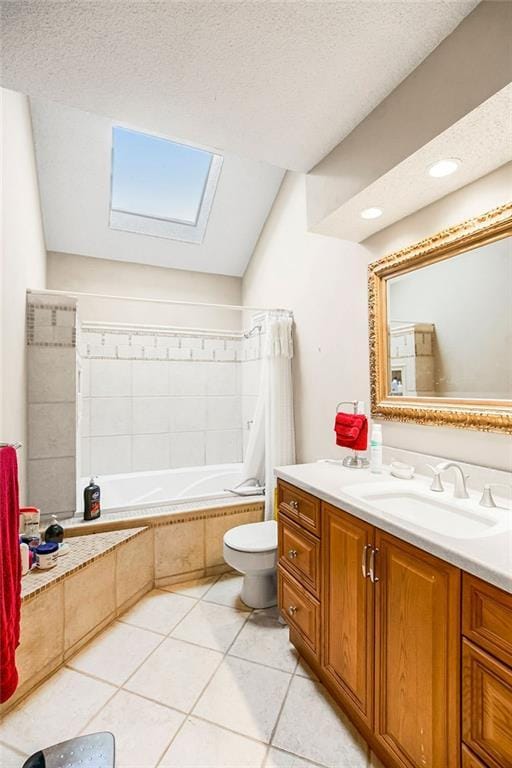 full bath featuring a textured ceiling, toilet, vanity, and tile patterned flooring