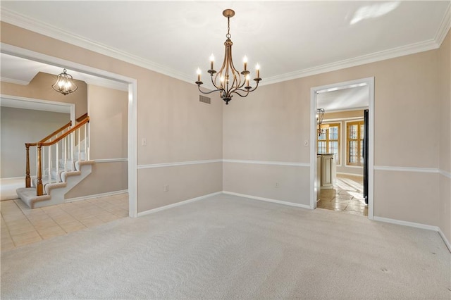 unfurnished room with visible vents, carpet flooring, crown molding, baseboards, and a chandelier