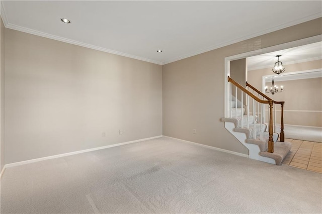 spare room with crown molding, baseboards, carpet floors, recessed lighting, and an inviting chandelier