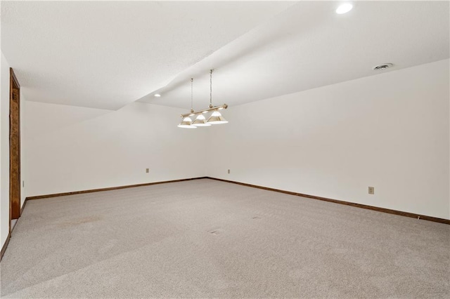 spare room featuring recessed lighting, visible vents, light colored carpet, and baseboards