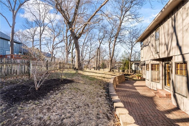 view of yard with a patio and fence