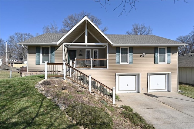 view of front facade featuring driveway, a front lawn, stairway, covered porch, and an attached garage