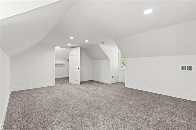 bonus room with visible vents, lofted ceiling, recessed lighting, carpet, and baseboards