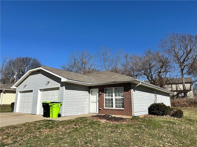 ranch-style home with brick siding, a front lawn, concrete driveway, and a garage