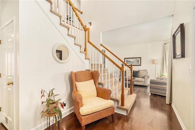 entrance foyer featuring stairway, wood finished floors, and baseboards