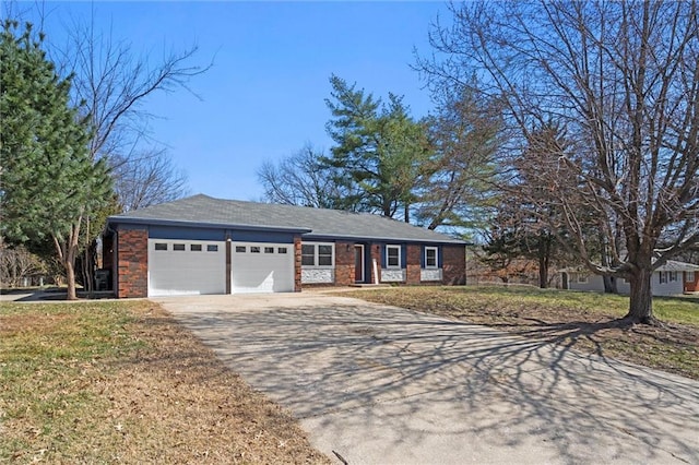 ranch-style house with brick siding, an attached garage, concrete driveway, and a front lawn