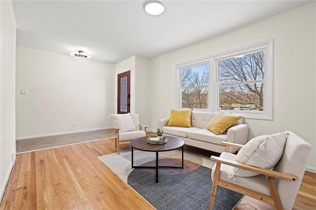 living room featuring wood finished floors and baseboards