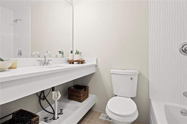 full bathroom with tile patterned flooring, shower / washtub combination, toilet, and a sink