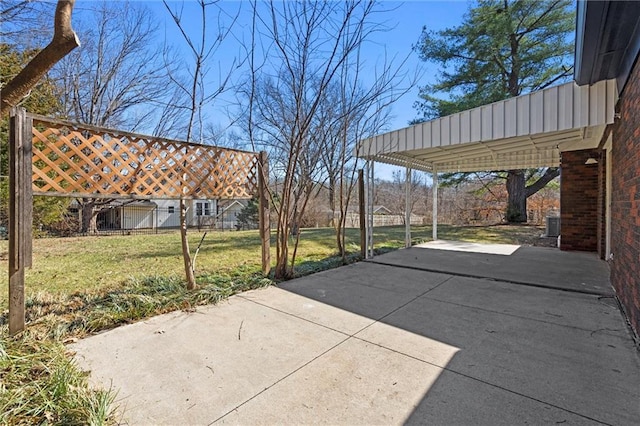 view of patio / terrace featuring a carport and concrete driveway