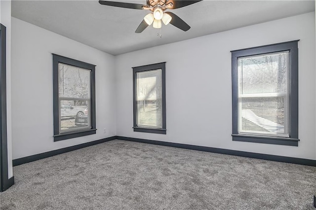 unfurnished room featuring baseboards, carpet, and a healthy amount of sunlight