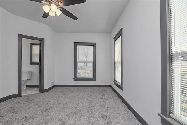 unfurnished bedroom featuring carpet flooring, ceiling fan, and baseboards