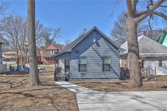 view of front of property featuring a chimney