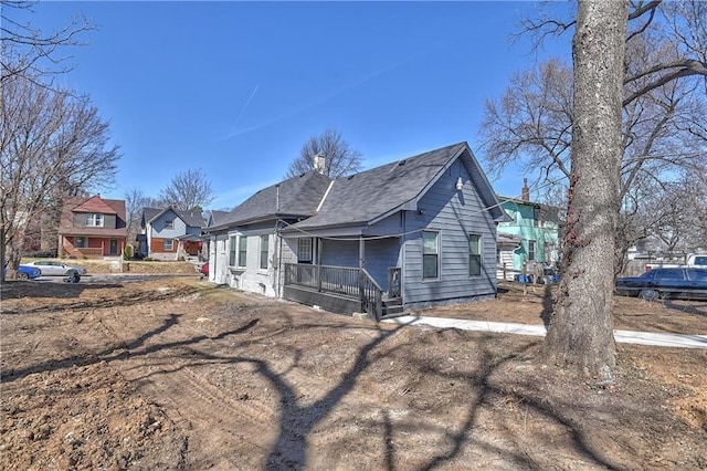 exterior space featuring a residential view and covered porch