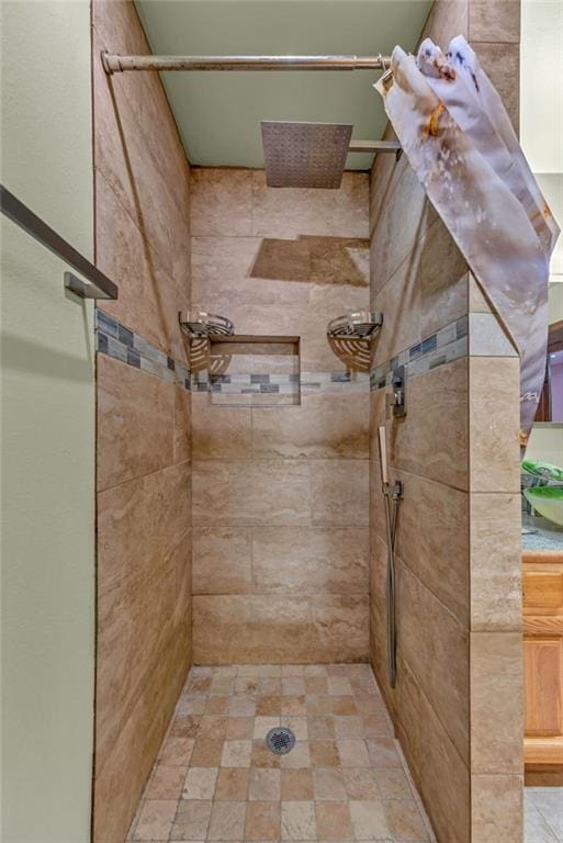 full bath featuring a tile shower