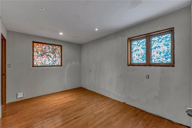 spare room with recessed lighting and light wood-style flooring