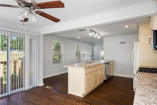 kitchen featuring a sink, visible vents, plenty of natural light, and stainless steel appliances