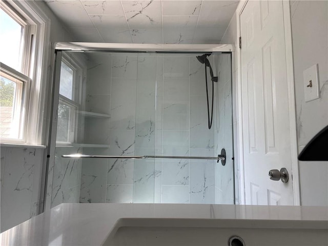 full bath featuring a shower stall