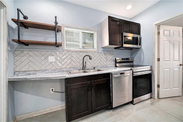 kitchen with a sink, light countertops, decorative backsplash, stainless steel appliances, and open shelves