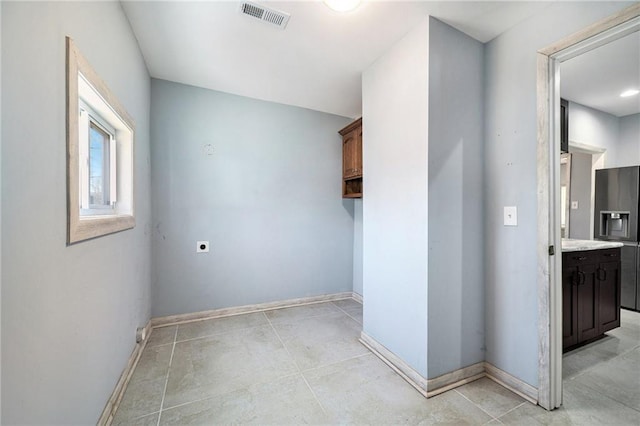 interior space featuring visible vents and baseboards