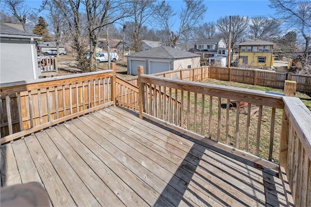 wooden terrace with an outbuilding, fence, and a residential view