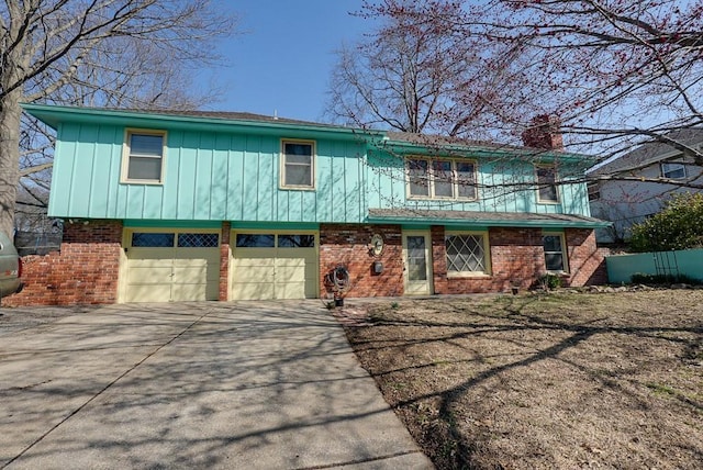 view of front of house featuring brick siding, board and batten siding, concrete driveway, a chimney, and an attached garage