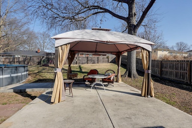 view of patio with a gazebo, a fenced in pool, and a fenced backyard