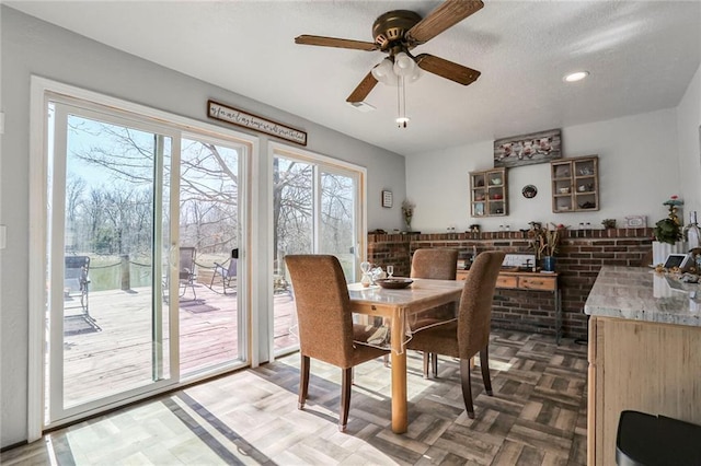 dining room featuring recessed lighting, a textured ceiling, and a ceiling fan