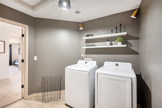 laundry area featuring visible vents, carpet floors, separate washer and dryer, baseboards, and laundry area