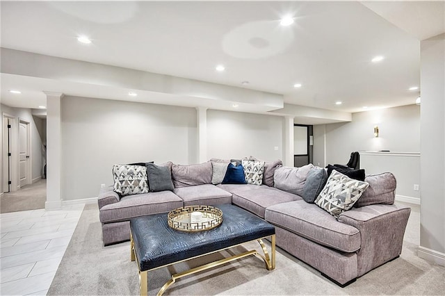 living area featuring recessed lighting and baseboards