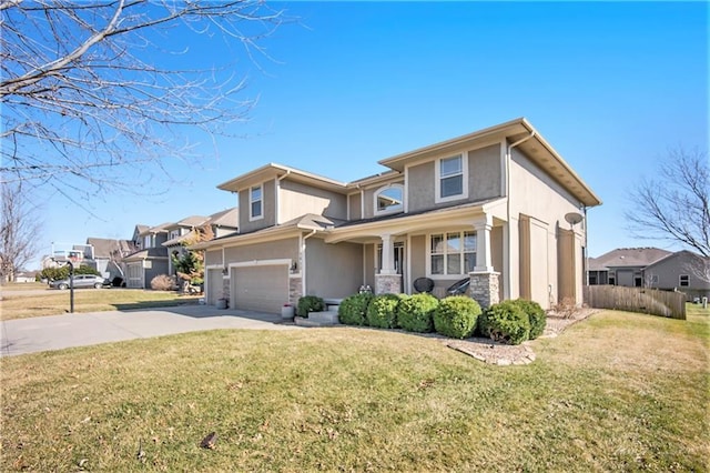 prairie-style home featuring a garage, stucco siding, concrete driveway, and a front lawn