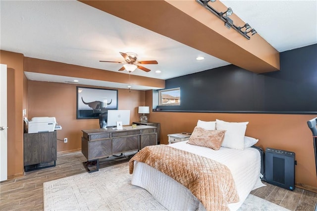 bedroom with recessed lighting, baseboards, and wood finish floors