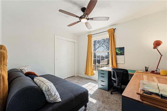 bedroom with a closet, baseboards, carpet, and a ceiling fan