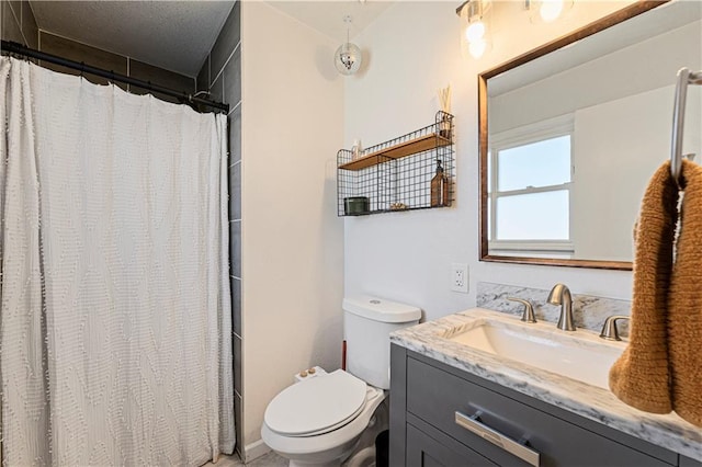 bathroom with a shower with shower curtain, toilet, and vanity