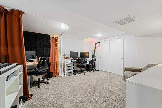 carpeted home office featuring visible vents