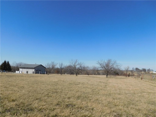 view of yard with a rural view