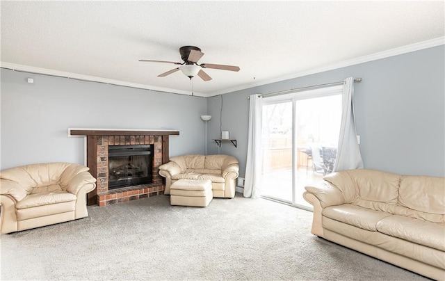 living area with a brick fireplace, crown molding, ceiling fan, and carpet floors