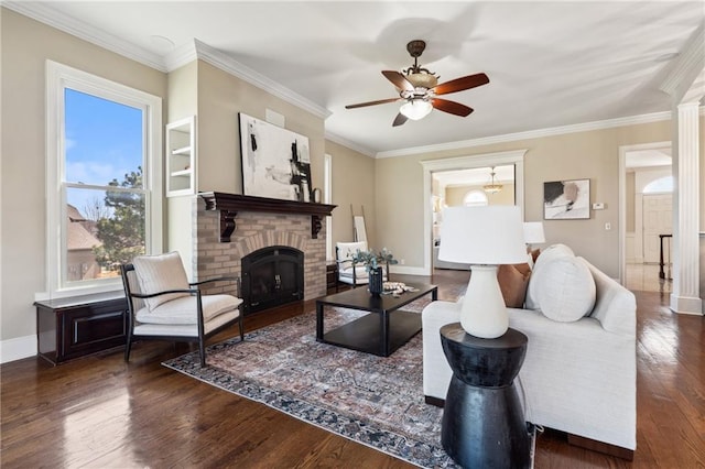 living room with baseboards, a brick fireplace, wood finished floors, and ornamental molding