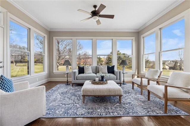 sunroom / solarium with a healthy amount of sunlight and a ceiling fan