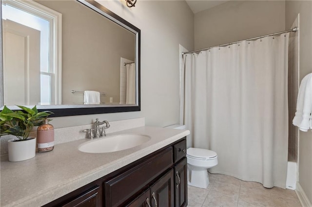 bathroom featuring tile patterned floors, toilet, curtained shower, and vanity