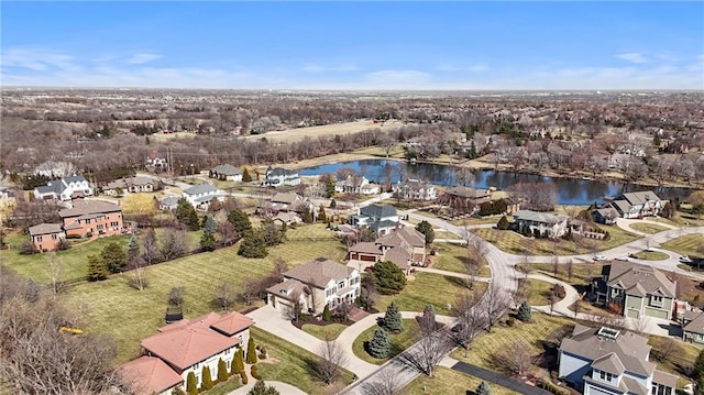 bird's eye view featuring a residential view and a water view