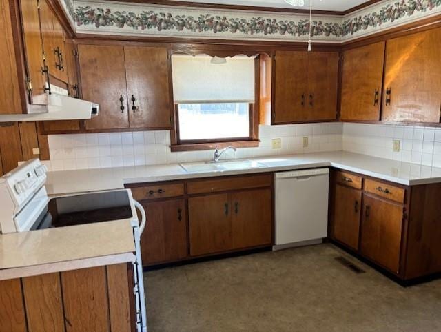 kitchen featuring electric stove, a sink, brown cabinetry, light countertops, and white dishwasher