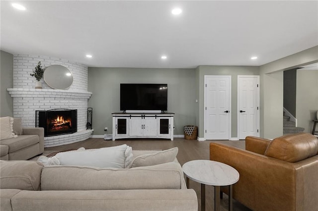 living room with stairway, recessed lighting, baseboards, and wood finished floors