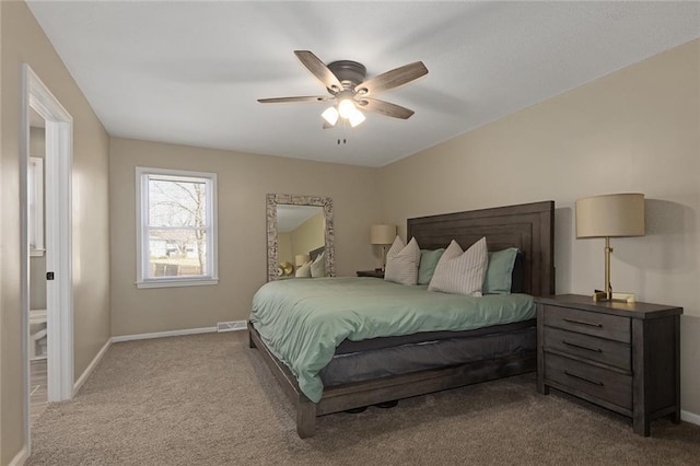 carpeted bedroom featuring visible vents, a ceiling fan, and baseboards