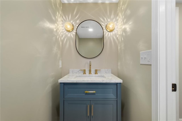 bathroom with visible vents and vanity