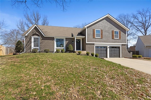 tri-level home with a front yard, fence, driveway, an attached garage, and brick siding